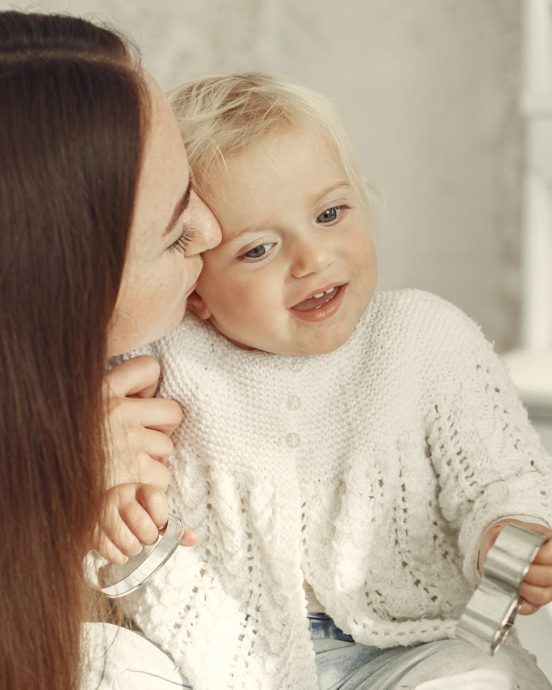 Caregiver embracing a smiling child