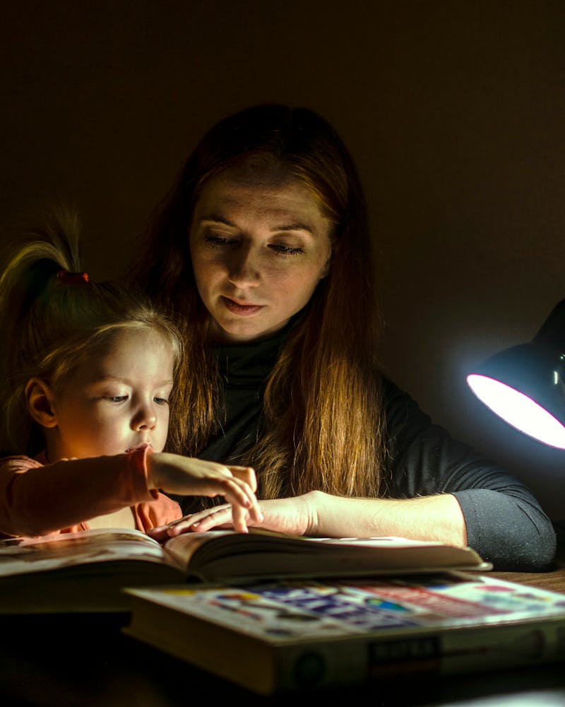 Mother and daughter reading the Bible together